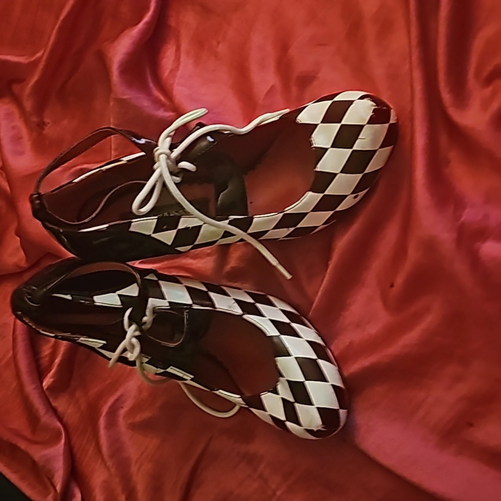 Never worn black and white checkered heels with string and a bow across the fron